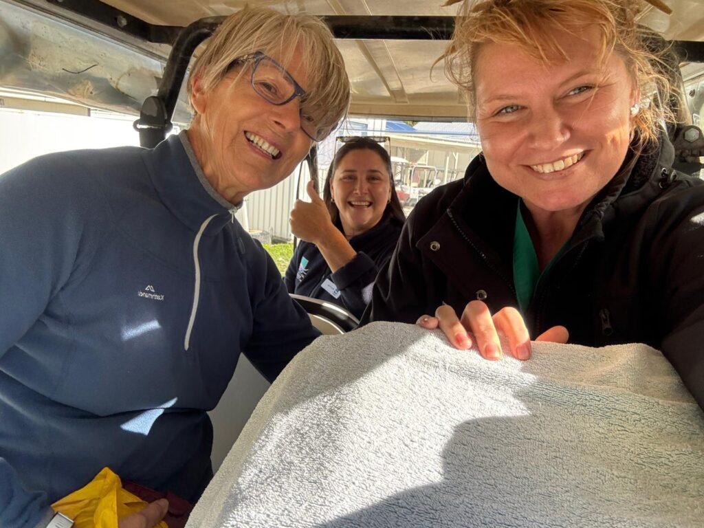 Vet and researchers transporting tropicbird hidden by blanket for release into wild
