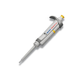 Laboratory micropipette with a yellow control button.