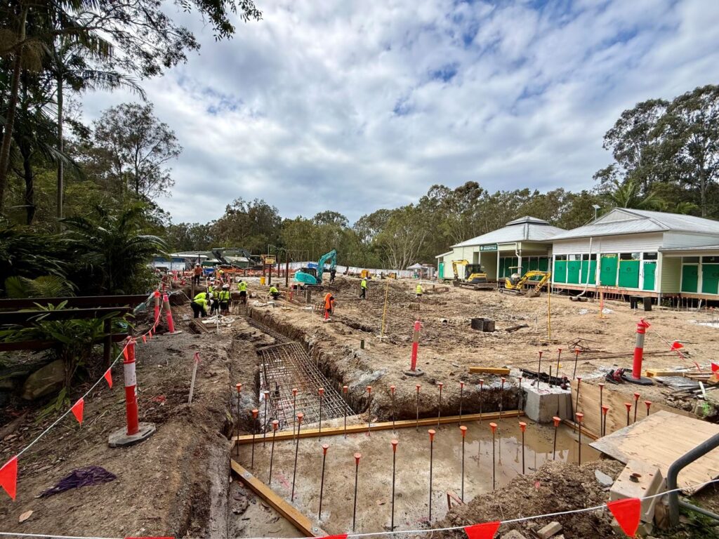 Construction site underway in front of Currumbin Wildlife Hospital with a group of workers on the ground