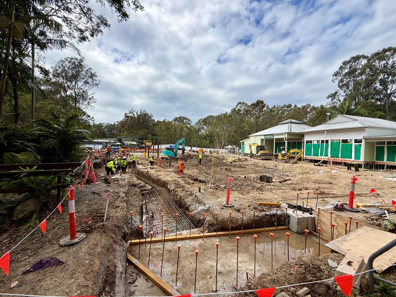 Construction site underway in front of Currumbin Wildlife Hospital with a group of workers on the ground