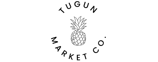 A logo of a pineapple illustration with the words Tugun Market Co. bended around it